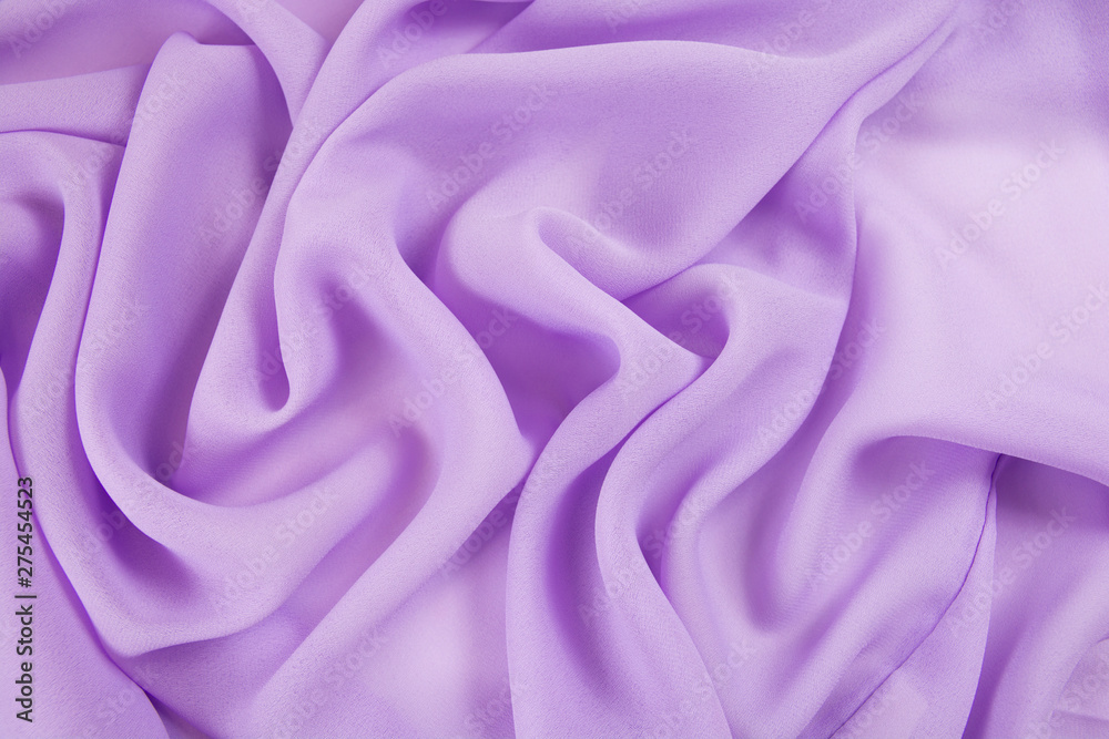 Obraz premium The texture of the satin fabric of lilac color for the background
