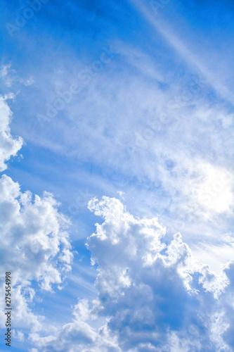 Blue sky background and fluffy white cloud in sunny day