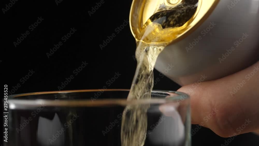 Pouring Cold Beer into a glass with water drops. Can of Beer close up. Pouring Cold Beer into a glass with water drops. Can of Beer close up.