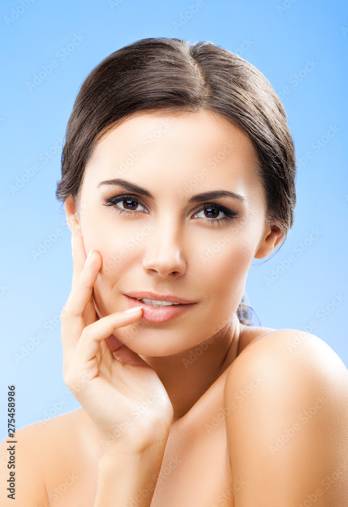 portrait of woman with naked shoulders, on blue portrait of woman with naked shoulders, on blue