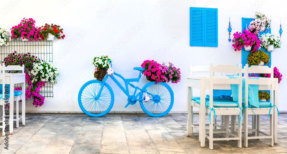 Charming street (outdoor) decoration with old bicycle and flowers. Bodrum, Turkey