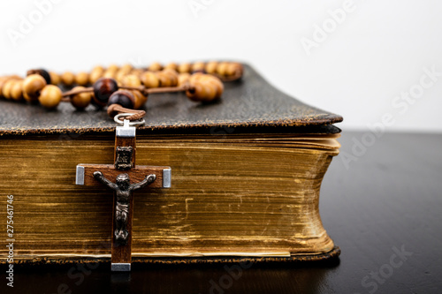 Rosary beads and prayer book. photo