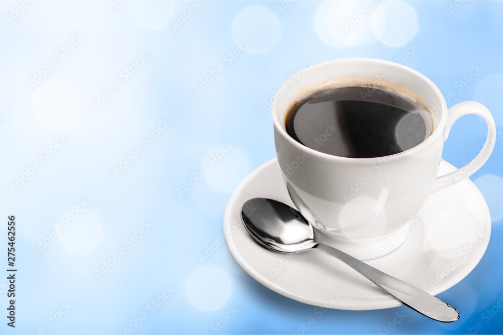 Coffee cup and spoon on wooden background Coffee cup and spoon on wooden background