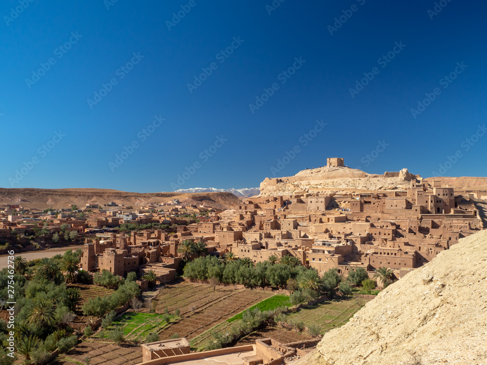 Ait Ben Haddou Kasbah, old medieval town in Morocco desert, castle fort gate, clay mud houses ruins, river in the mountiains