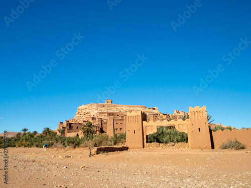 Ait Ben Haddou Kasbah, old medieval town in Morocco desert, castle fort gate, clay mud houses ruins, river in the mountiains