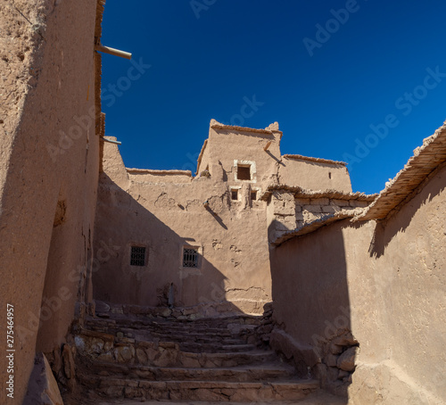 Ait Ben Haddou Kasbah, old medieval town in Morocco desert, castle fort gate, clay mud houses ruins, river in the mountiains photo