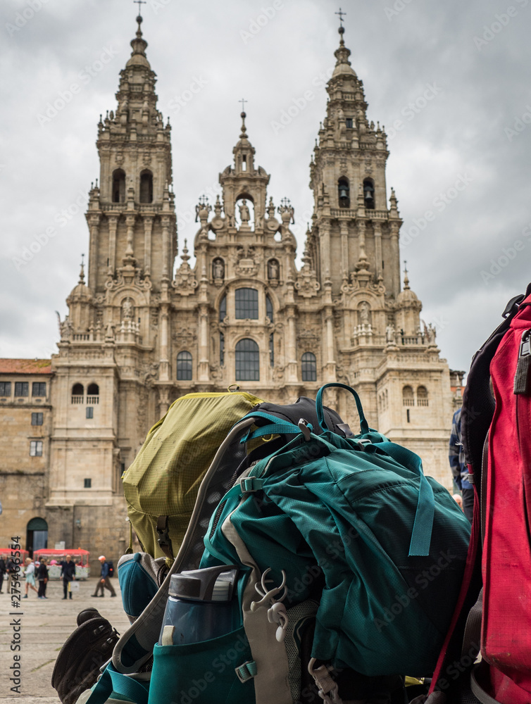 Backpack of pilgrim with the Santiago de Compostela Cathedral in the Obradoiro square in Santiago de Compostela (Spain)