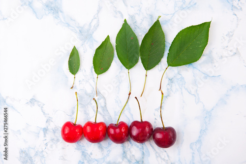 Fresh red cherries on the marble table. photo