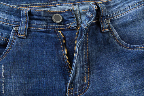 Blue jeans pocket, button and open zipper