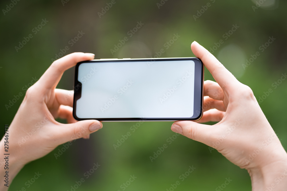 Close-up of female working using smartphone blurred images in Close-up of female working using smartphone blurred images in