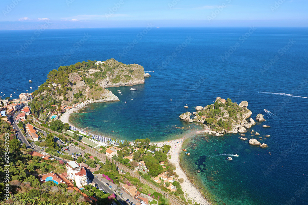 Beautiful aerial view of Taormina, Italy. Sicilian seascape with Isola Bella island and beach.