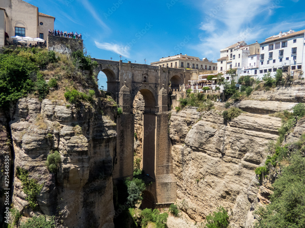 Cliffs and Puente Nuevo bridge in Ronda, one of the famous villages in Andalusia, Spain. Cliffs and Puente Nuevo bridge in Ronda, one of the famous villages in Andalusia, Spain.