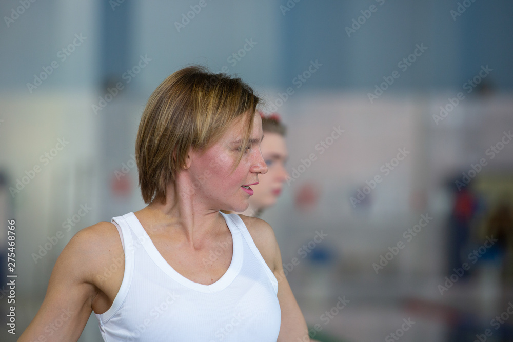 Pretty swimming coach smiling at camera at the leisure center Pretty swimming coach smiling at camera at the leisure center