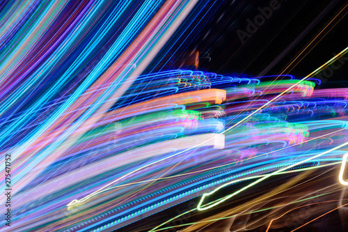 Abstract background of night light on street. Multicolored striped lines in motion made from lighting effect ,Light trails over black long exposure shot concept.