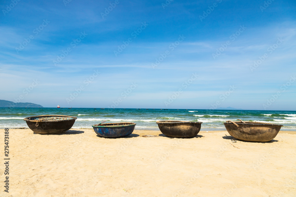 Basket boats on My Khe beach in Danang. Traditional Vietnamese small fishing boats on My Khe Beach in Danang, Vietnam.