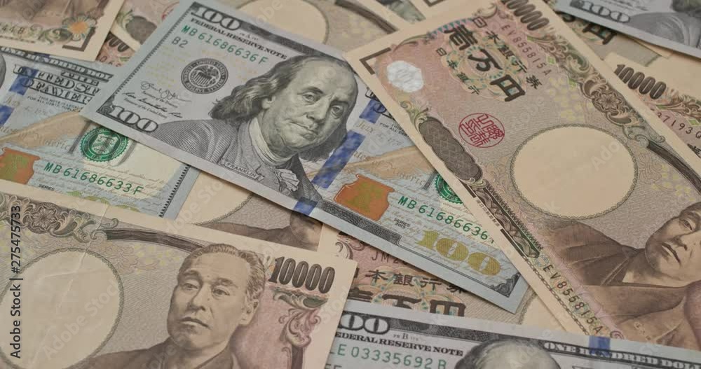 Stack of American USD and Japanese Yen banknote Stack of American USD and Japanese Yen banknote