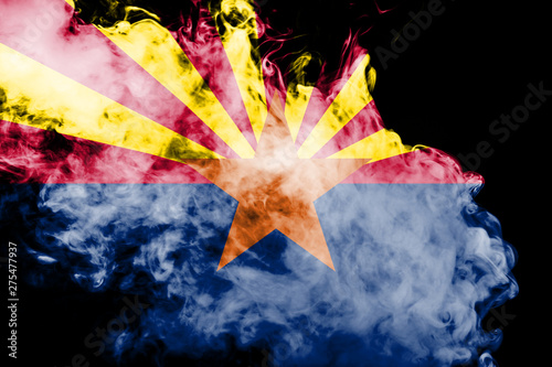 The national flag of the US state Arizona in against a gray smoke on the day of independence in different colors of blue red and yellow. Political and religious disputes  customs and delivery.