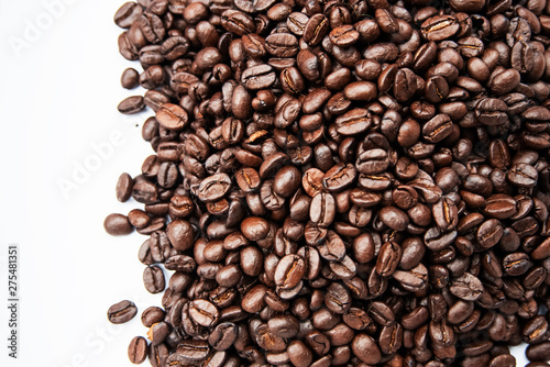 Closeup group of coffee bean on white background,blurry light around