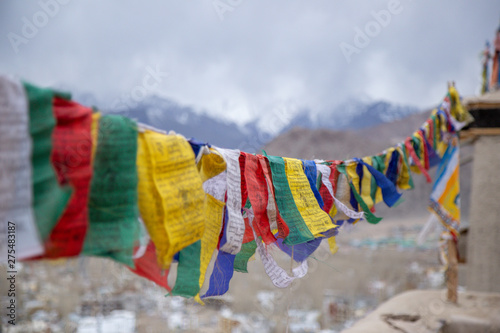 Buddhist Tibetan prayer flag colorful flag different in five color different meaning, Leh Ladakh, India on background of Himalaya mountain. photo