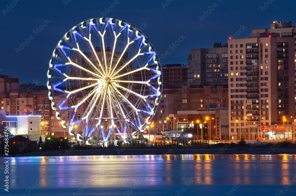 Kazan city at night, view from the embankment of the Kazanka river on the Ferris wheel