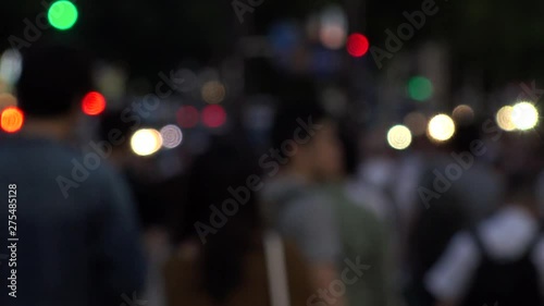 Wallpaper Mural SHINJUKU, TOKYO, JAPAN - CIRCA JUNE 2019 : View of crowd of people walking down the street in busy rush hour. Many commuter walking to the train station after work. Shot in early evening. Defocus shot Torontodigital.ca