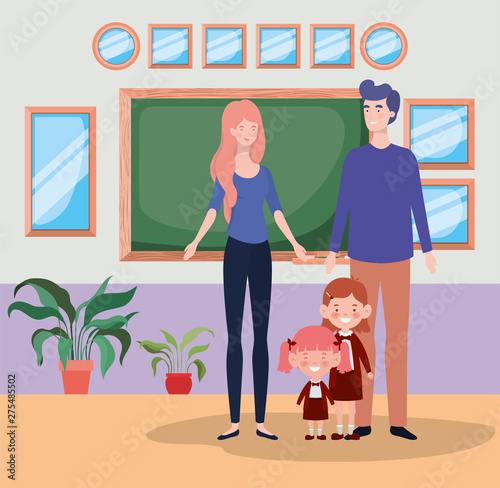 teacher couple with little students kids in the school corridor