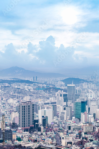 Seoul cityscapes, skyline, high rise office buildings and skyscrapers in Seoul city, winter daylight, top view in winter, Seoul, Republic of Korea, in mist winter season with blue sky and cloud