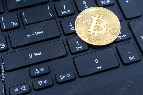 Shiny bitcoin on the keyboard