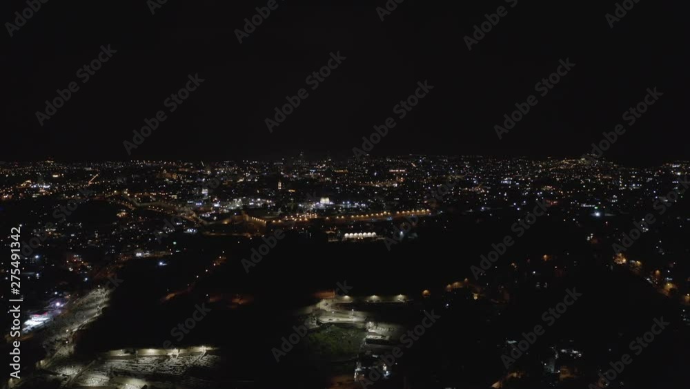 night drone shot of Jerusalem. Aerial view of the illuminated streets in the mediterranean metropolis night drone shot of Jerusalem. Aerial view of the illuminated streets in the mediterranean metropolis