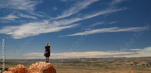 silhouette of a woman on top of the mountain