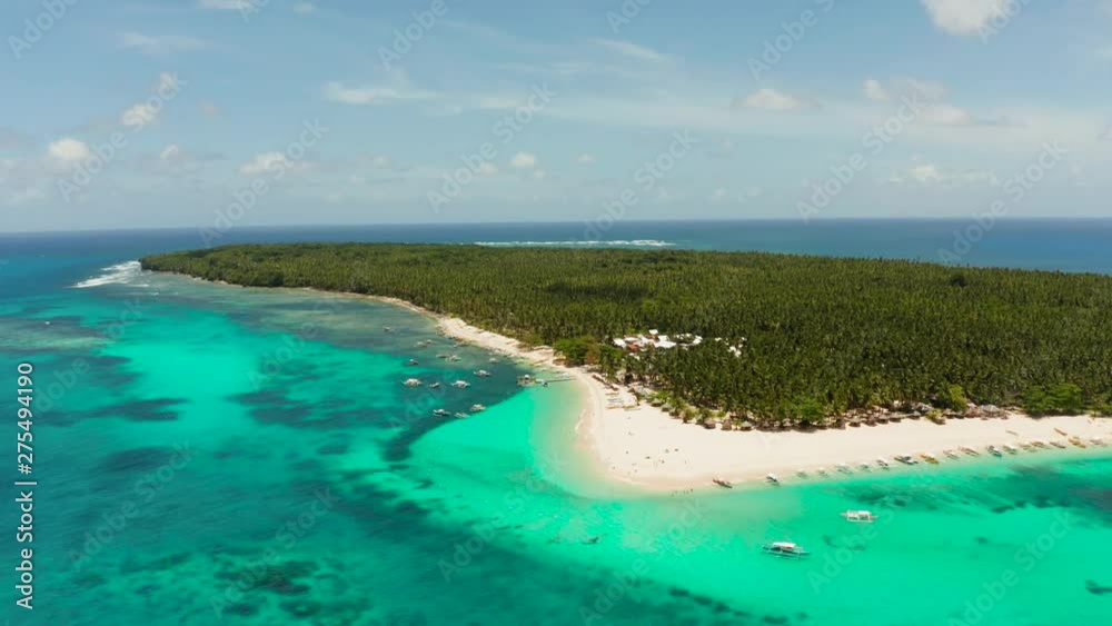 Travel concept: sandy beach on a tropical island by coral reef atoll from above. Daco island, Philippines. Summer and travel vacation concept Travel concept: sandy beach on a tropical island by coral reef atoll from above. Daco island, Philippines. Summer and travel vacation concept