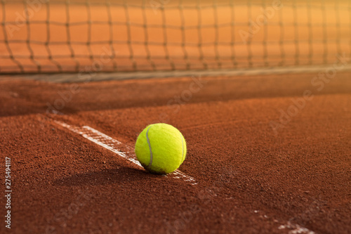 Tennis game. Tennis ball on the tennis court. Sport, recreation concept © Hazal