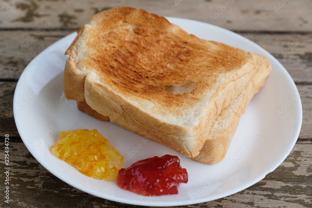 roasted bread with orange and strawberry jam roasted bread with orange and strawberry jam