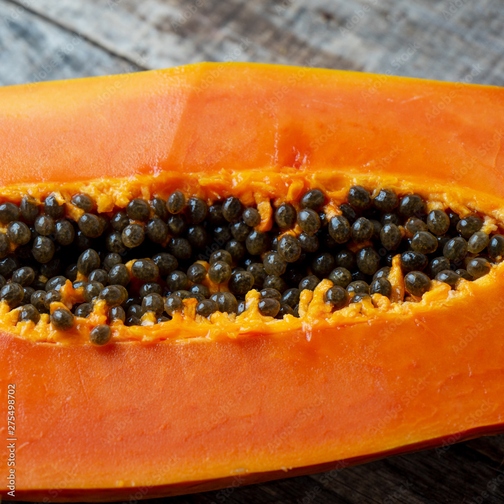 Half of tasty papaya with seeds Half of tasty papaya with seeds