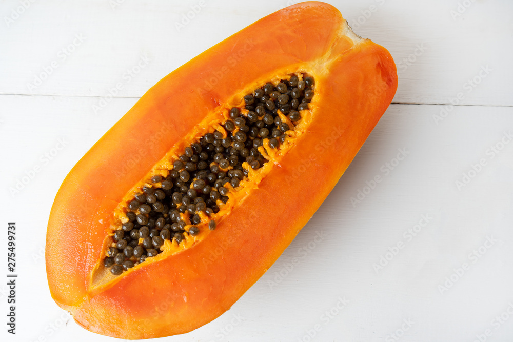 Half of tasty papaya with seeds Half of tasty papaya with seeds