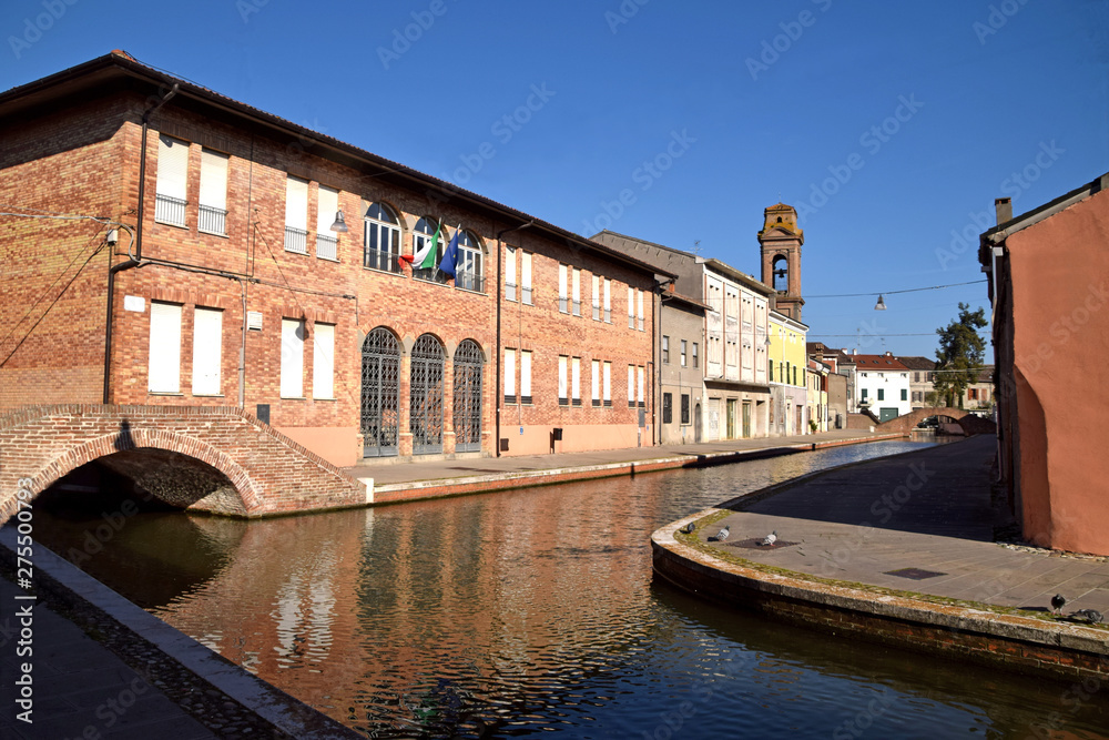 Between the bridges and the old houses on the canals of the village of Comacchio - Italy