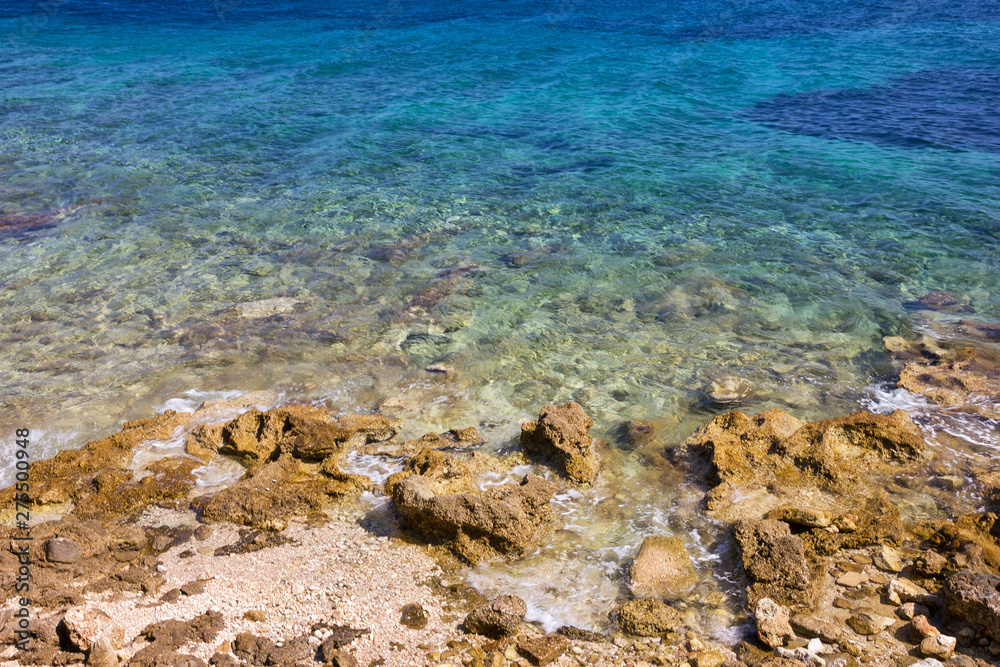 Stones in blue Adriatic sea water