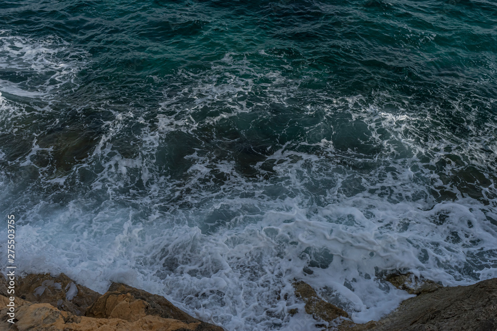 Fototapeta premium Mediterranean sea crashing against the rocks of the Spanish island of Mallorca, Ibiza, Spain.