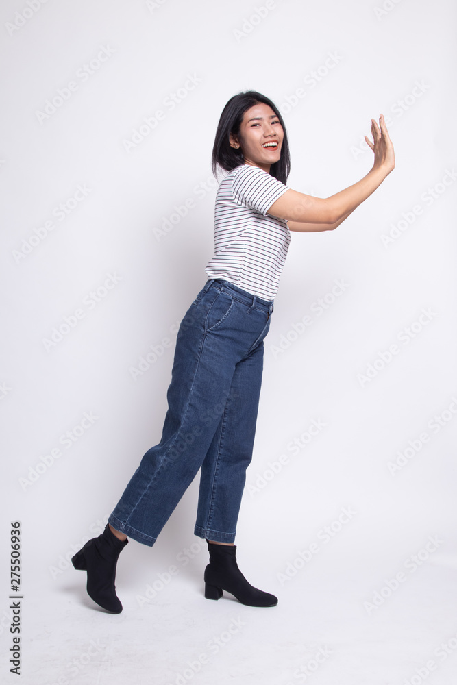 Full body of beautiful young asian woman push something. Full body of beautiful young asian woman push something.