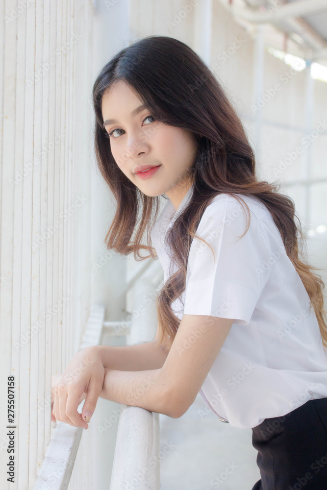 Portrait of thai adult student university uniform beautiful girl relax and smile Portrait of thai adult student university uniform beautiful girl relax and smile