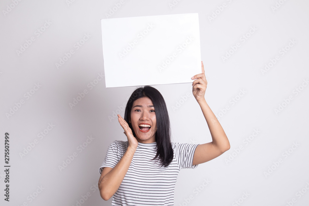 Young Asian woman surprise with white blank sign. Young Asian woman surprise with white blank sign.