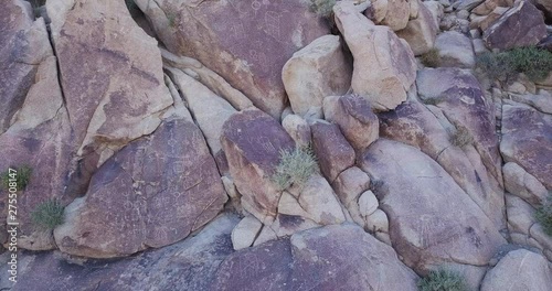 drone circling around boulders in Joshua  Tree national park with Native American Petroglyphs, Coyote Hole Canyon, yucca valley,california, mojave desert, photo