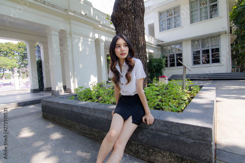 Portrait of thai adult student university uniform beautiful girl relax and smile