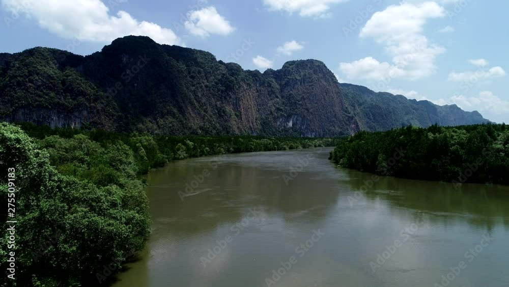 Aerial view drone shot of beautiful natural scenery river in mangrove forest and high mountains in phang nga province Thailand Aerial view drone shot of beautiful natural scenery river in mangrove forest and high mountains in phang nga province Thailand