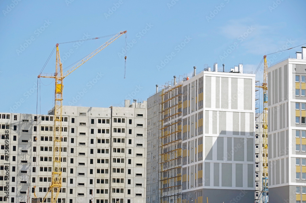 Building crane and building under construction Building crane and building under construction