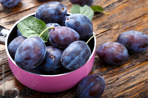 fresh ripe plum on the table