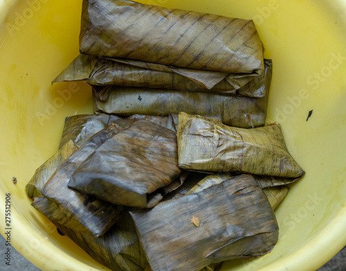 traditional tamales, wrapped in banana leaf valladolid, mexico photo