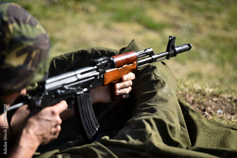 Outdoor target shooting with assault rifle Outdoor target shooting with assault rifle