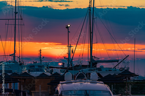 Fototapeta Naklejka Na Ścianę i Meble -  Sunset on a harbour with some boats
