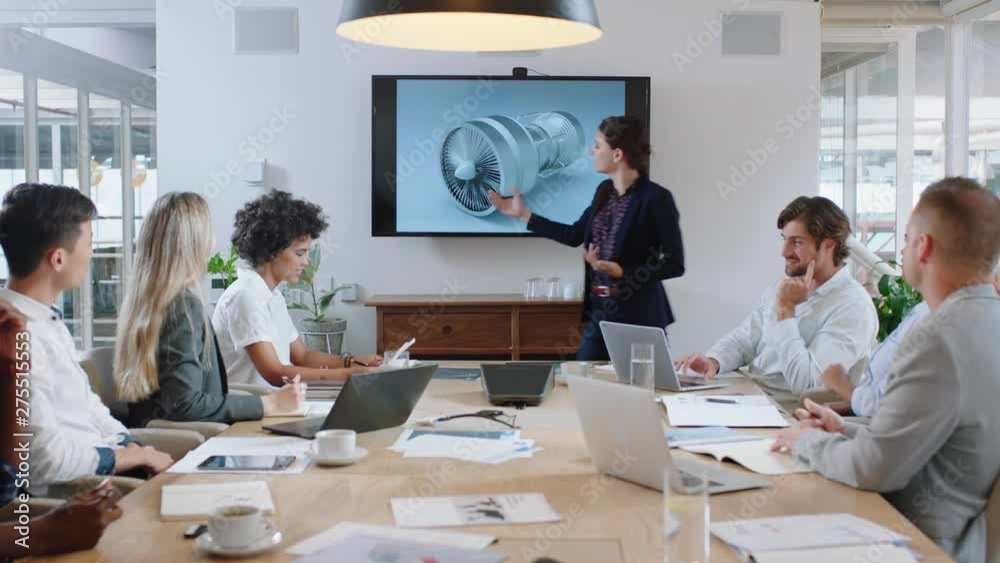 business people meeting in boardroom engineer woman presenting turbine design on tv screen sharing technical briefing with colleagues discussing ideas in office presentation